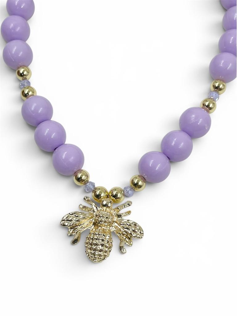 Collar Chunky Abeja Gold de bolas acrílicas doradas con separadores de cristal facetado y dije de abeja, diseño llamativo y moderno.