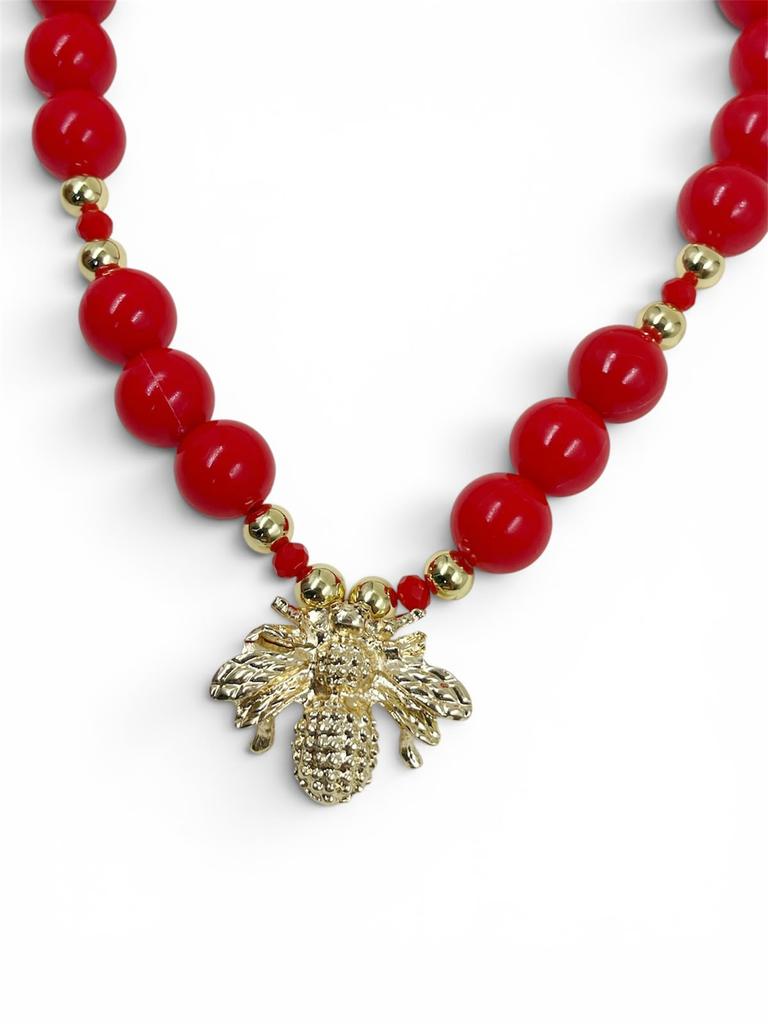 Collar Chunky Abeja Gold de bolas acrílicas doradas con separadores de cristal facetado y dije de abeja, diseño llamativo y moderno.