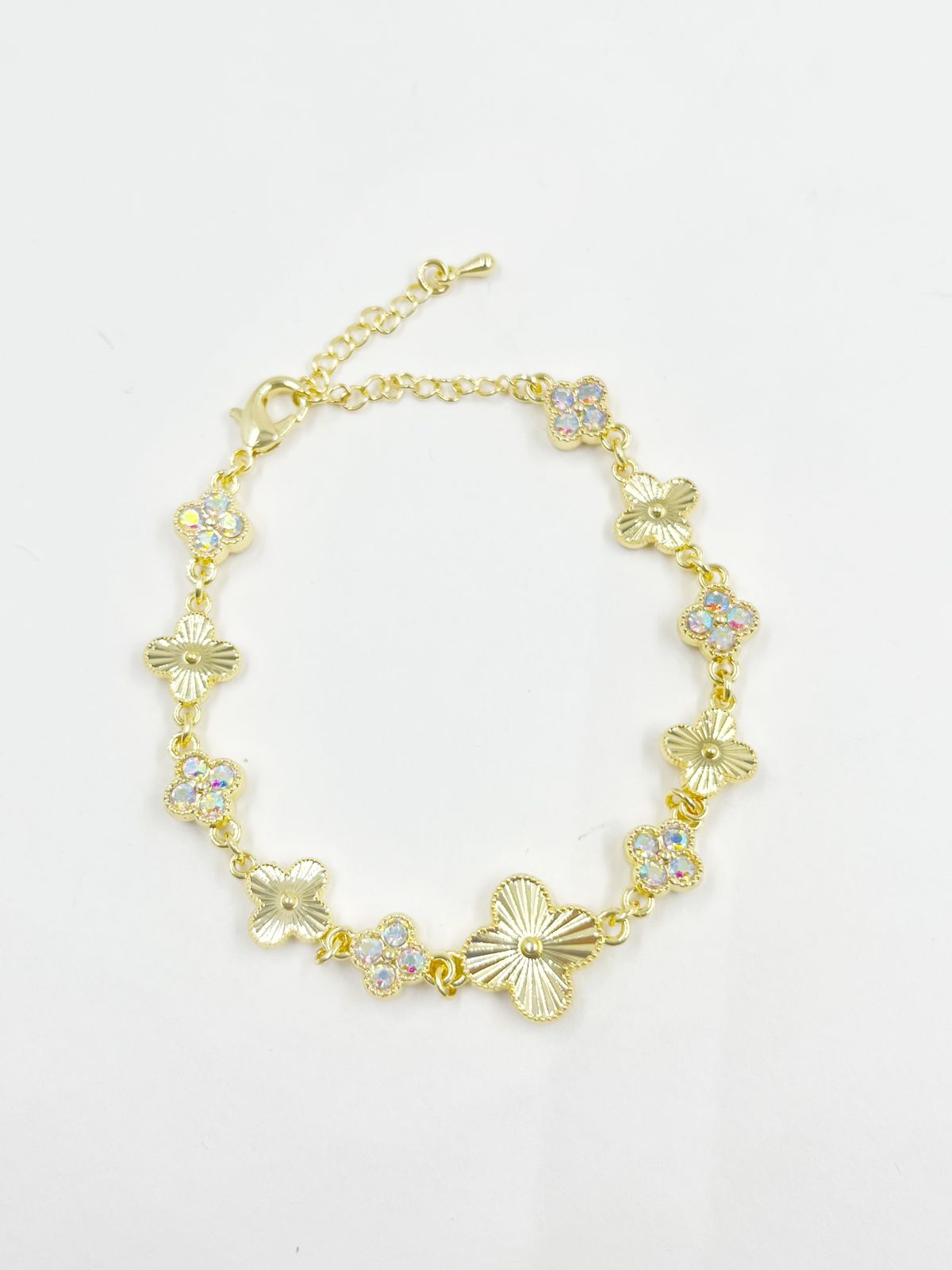 Pulsera en rodinado con incrustación de cristales en colores y tréboles dorados – Largo 17+5 cm