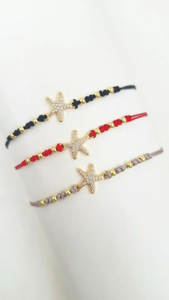 Pulsera Estrella Mar Brillante en hilo coreano con balines rodinados y dije estrella con microcircones.