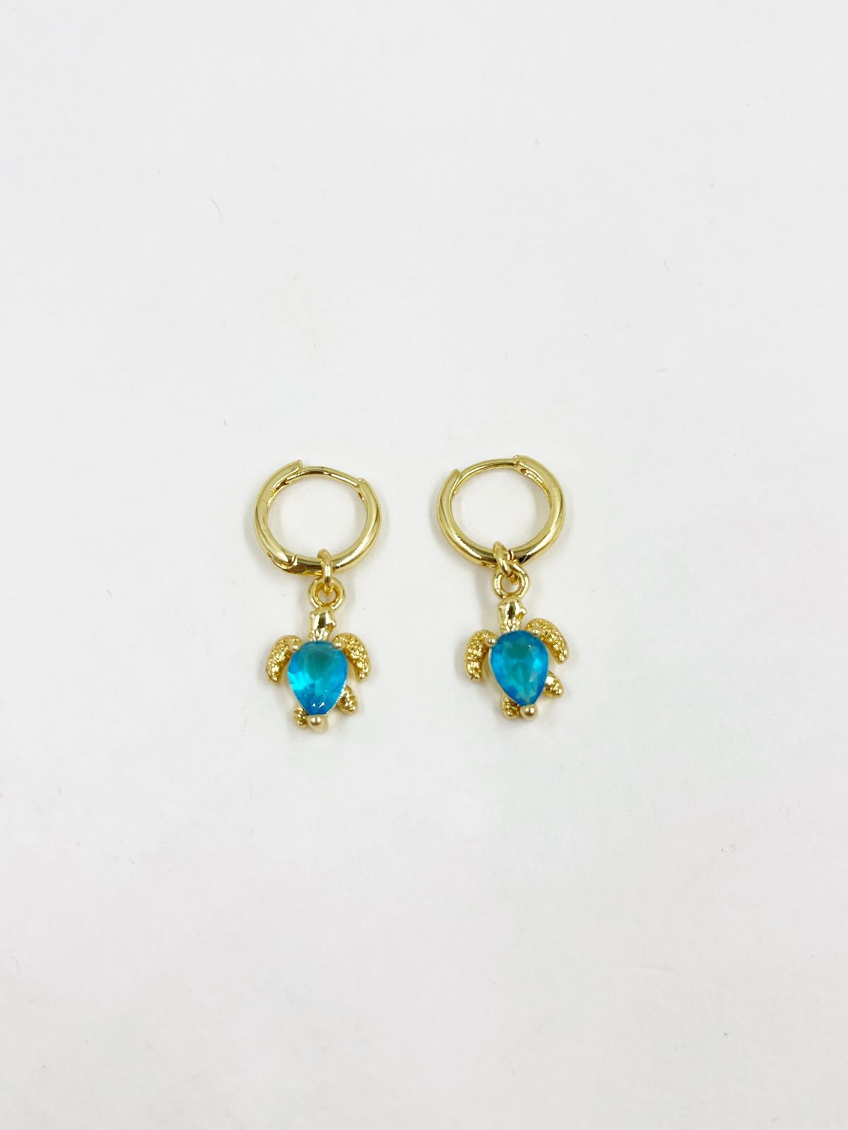 Aretes de rodinado con dije incrustado de gema cristal azul – Largo 2.8 cm