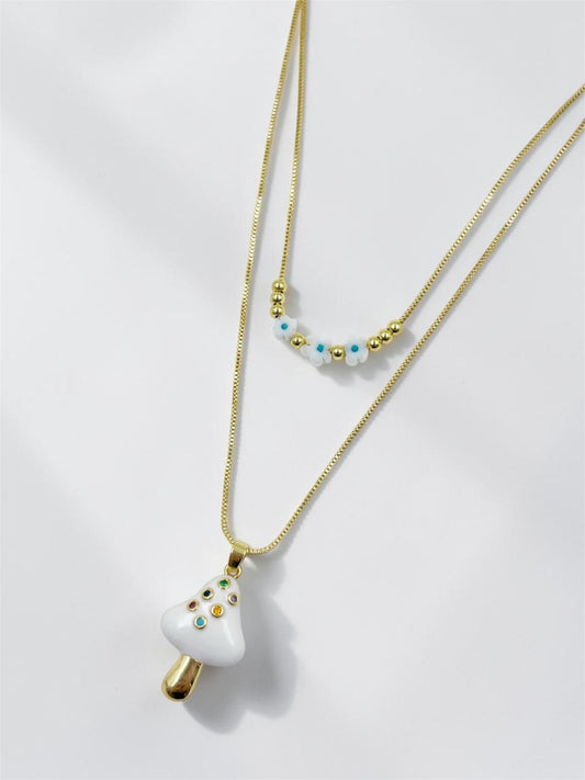 "Collar Hongo con dije rodinado lacado e incrustación de piedras"

"Collar con cadenas tipo aguja, balines rodinados y dije flor acrílica"
