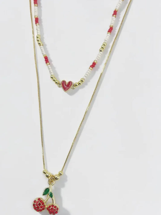 Collar Brillo Cerezado doble con dije de corazón y cereza
Collar femenino con mostacillas checas y dije de cereza con piedras
Collar moderno dorado con diseño doble y dijes románticos