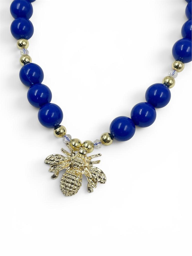 Collar Chunky Abeja Gold de bolas acrílicas doradas con separadores de cristal facetado y dije de abeja, diseño llamativo y moderno.