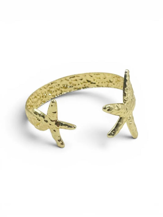 Brazalete Star Duplex Martillada dorada ajustable para mujer
Brazalete moderno con acabado martillado y diseño elegante
Accesorio dorado ajustable para muñeca o antebrazo