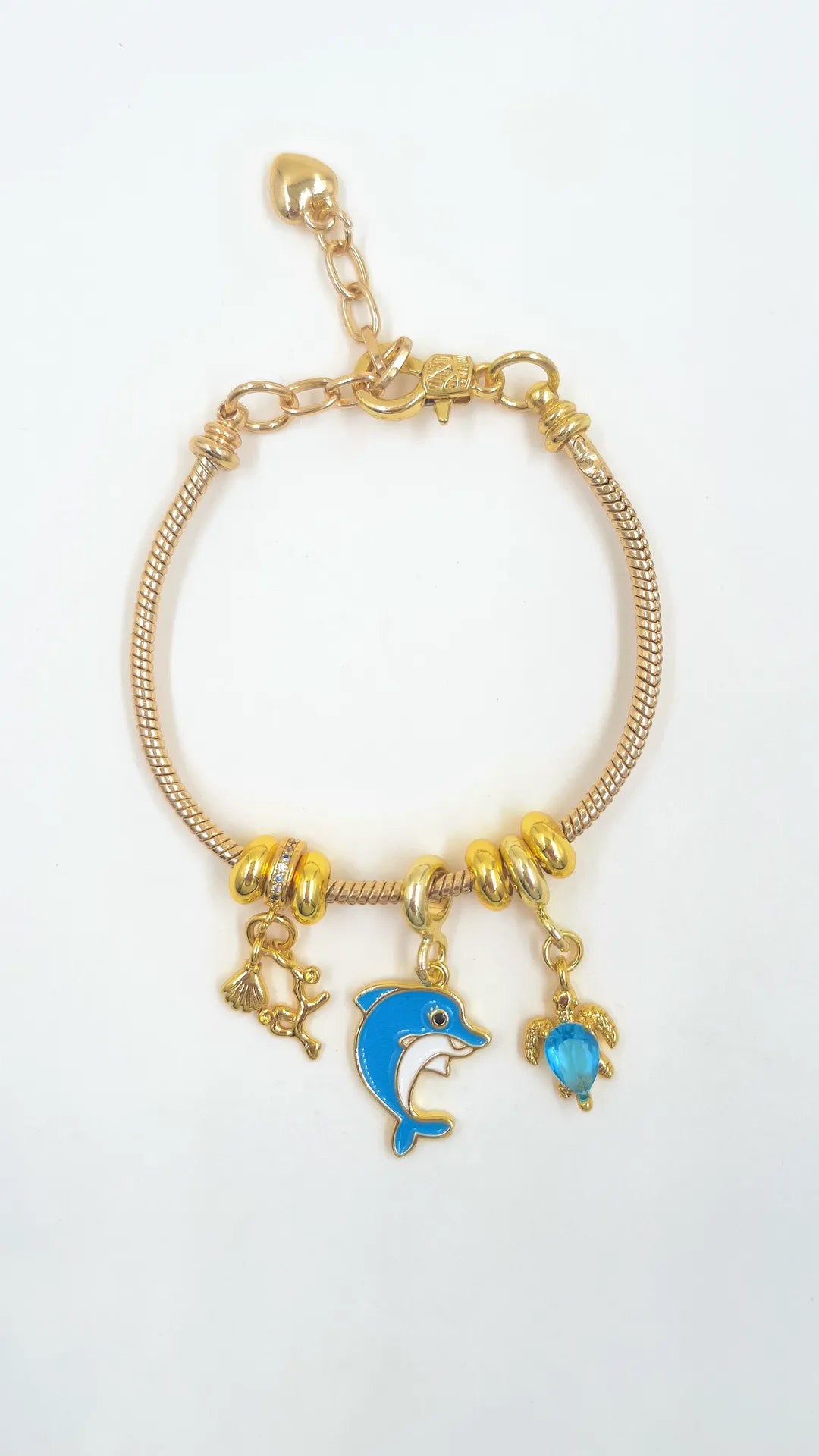 Pulsera Charms Delfín en guaya metálica rodinada con dije delfín pintado y dijes rodinados