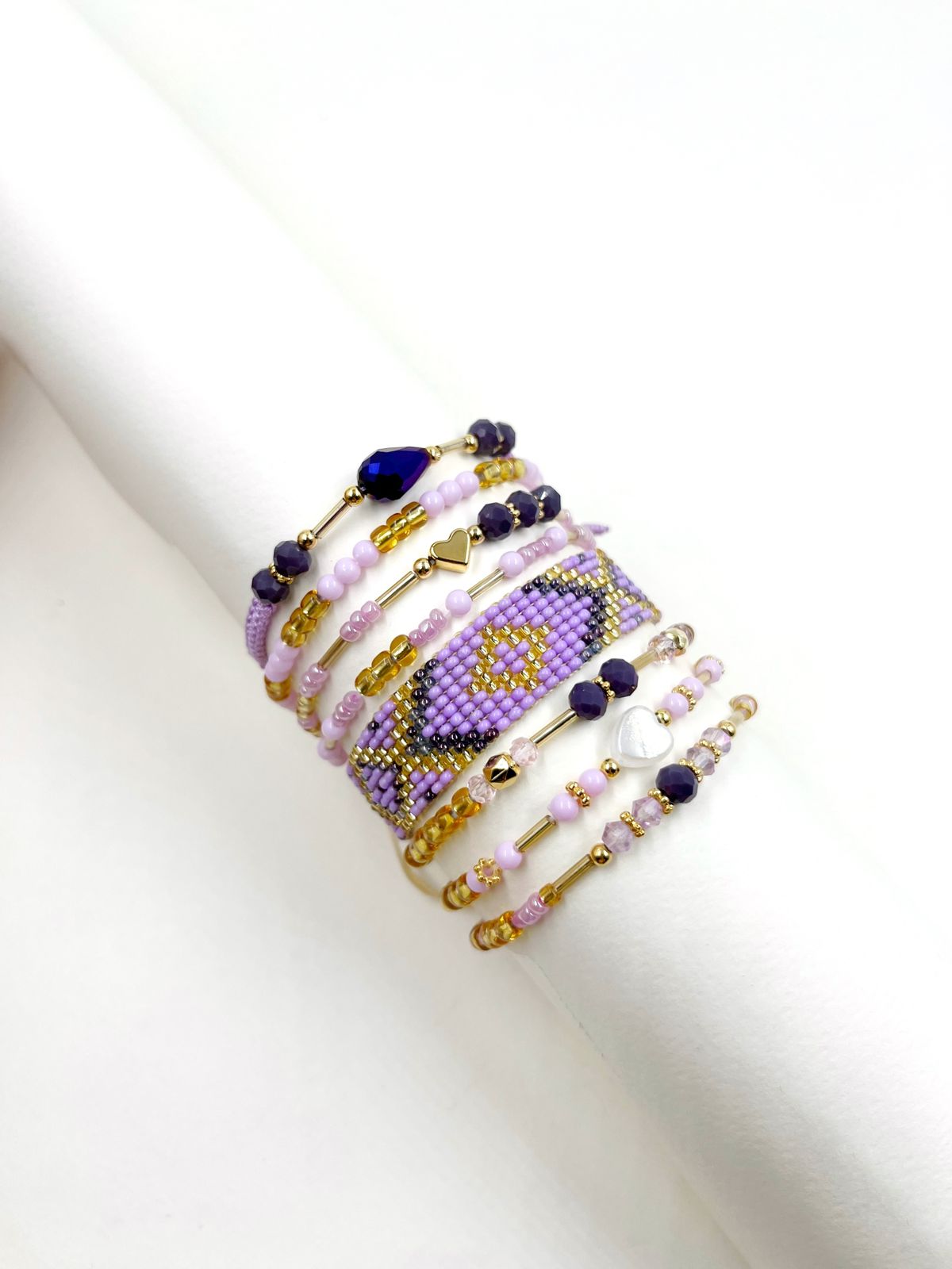 Pulsera de 6 vueltas en nylon elástico con cristales rondel lila, acrílicos perlados y baño de oro 18k – Ajustable