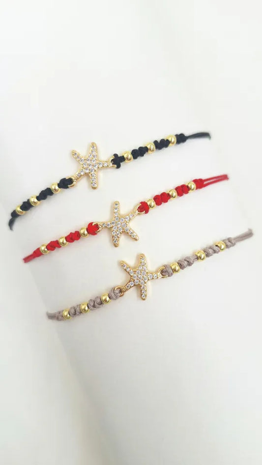Pulsera Estrella Mar Brillante en hilo coreano con balines rodinados y dije estrella con microcircones.